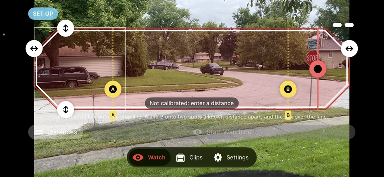 y u no stop’s road setup view with a lane zone, stop line, and distance markers over a neighborhood intersection